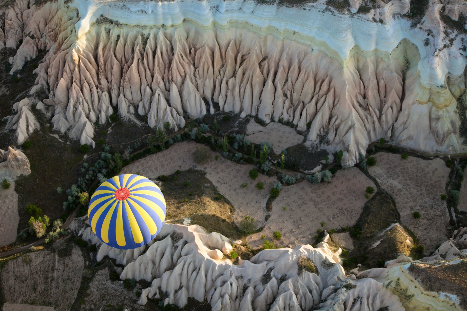 CAPPADOKIA View of the air balloon flying over rock formation TURKEY