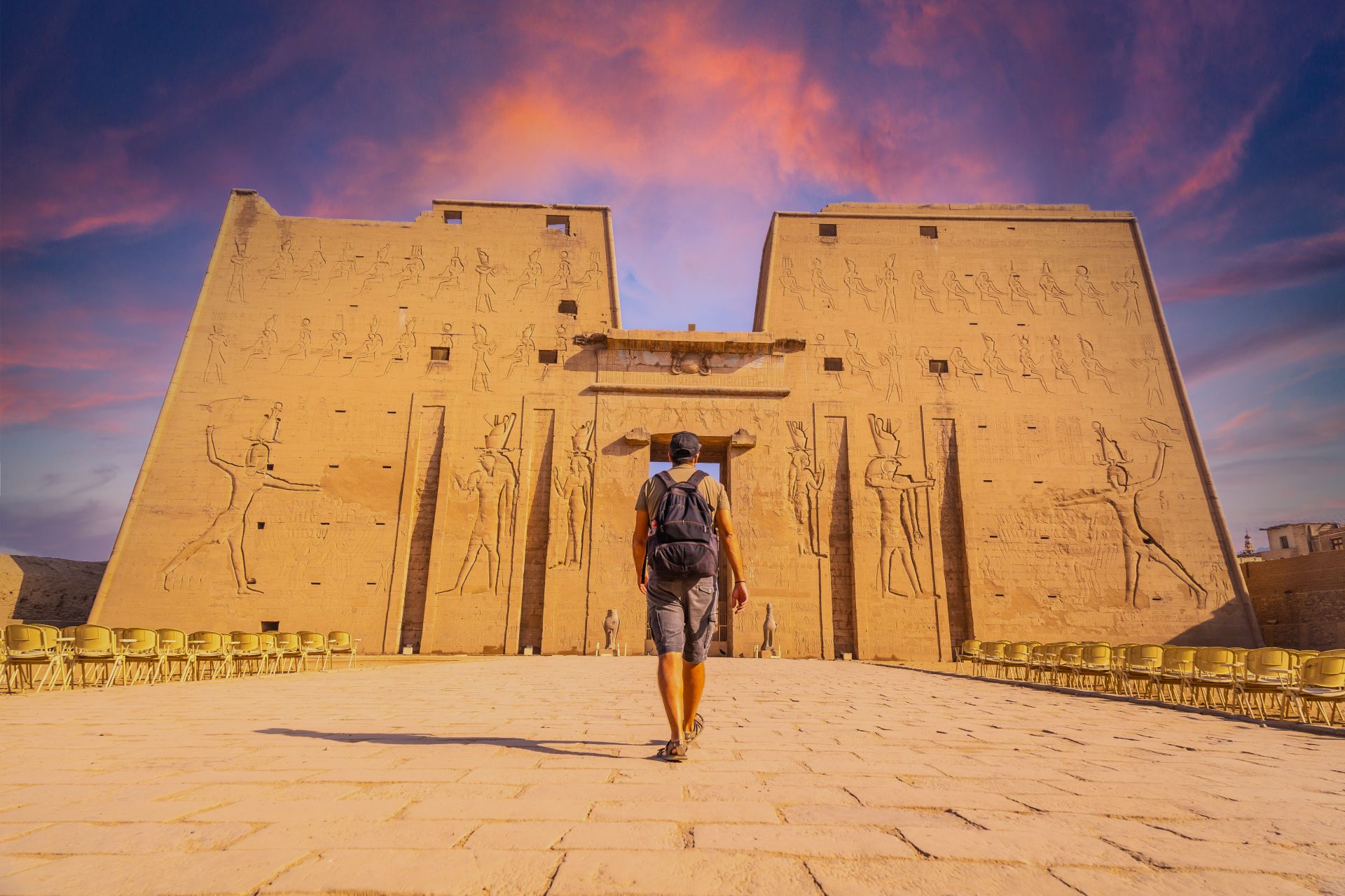 A young tourist entering the Temple of Edfu
