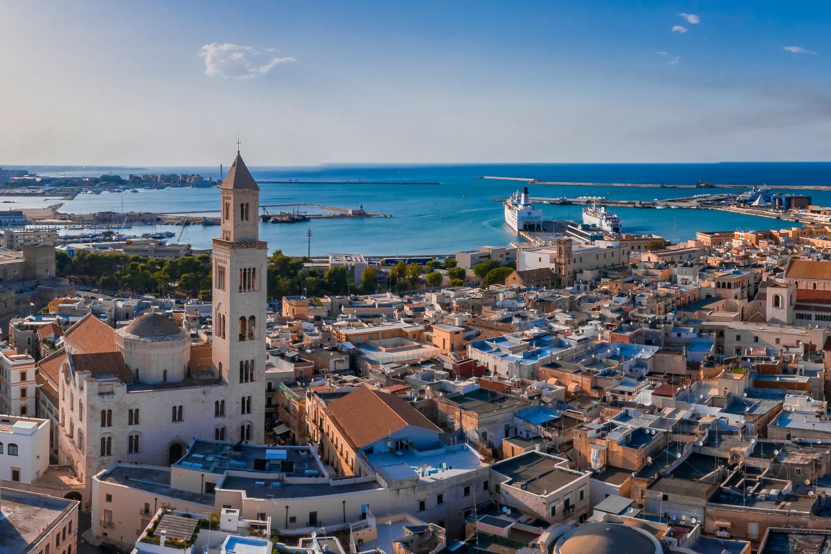Panoramic shot of the Bari Cathedral surrounded by buildings and sea in Italy